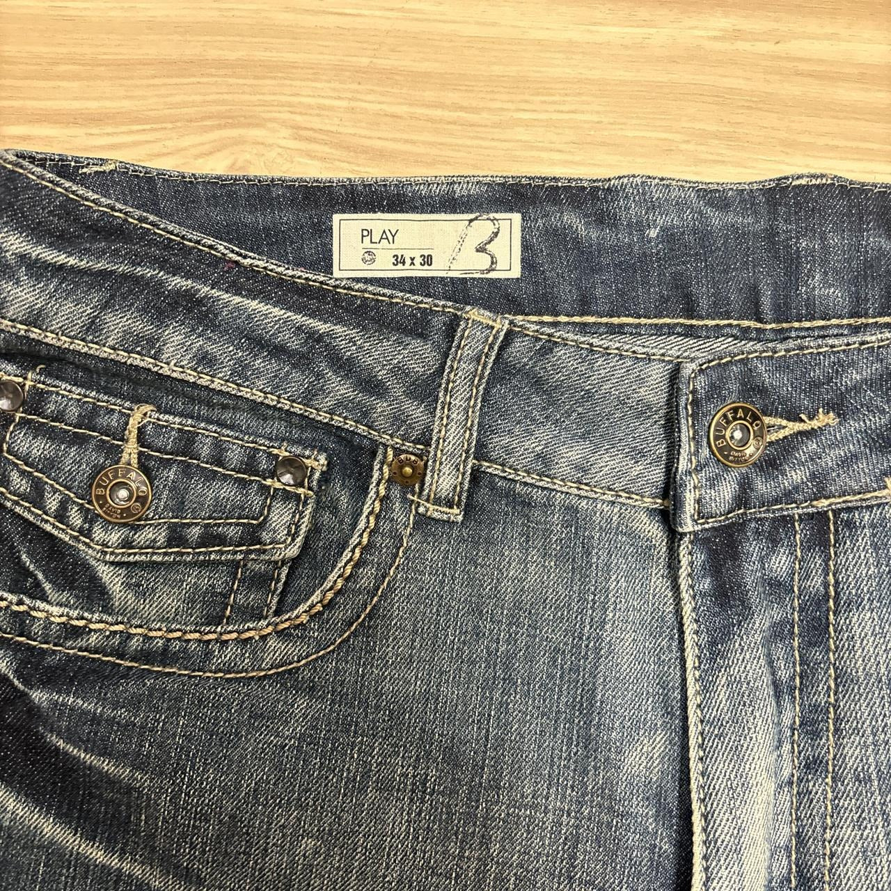 0557 - Y2K Buffalo Embroidered Faded Jeans